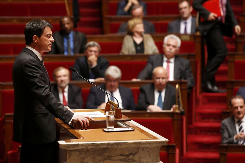 © Reuters. French Prime Minister Manuel Valls delivers a speech to use the article 49.3 and impose by decree a labour law reform bill, during its second hearing at the National Assembly in Paris