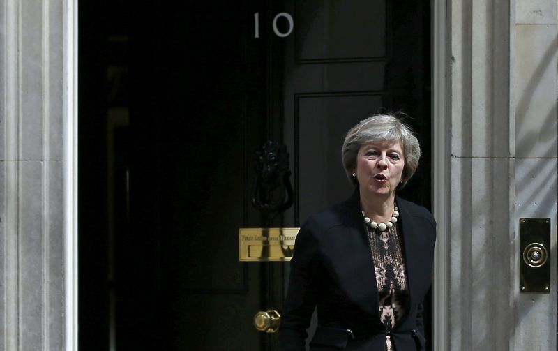 © Reuters. Britain's Home Secretary, Theresa May, leaves after attending a cabinet meeting at Number 10 Downing Street in London