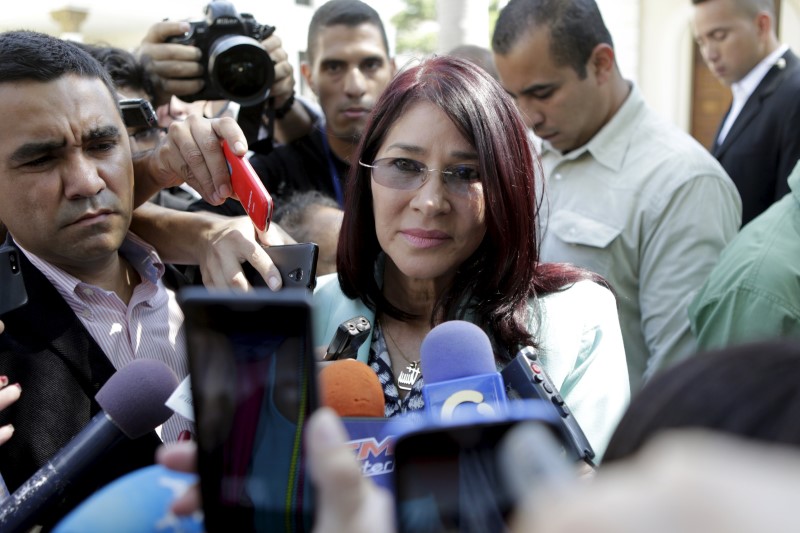 © Reuters. Flores, deputy of Venezuela's United Socialist Party and wife of Venezuela's President Nicolas Maduro, talks to the media after a failed session of the National Assembly for lack of quorum in Caracas