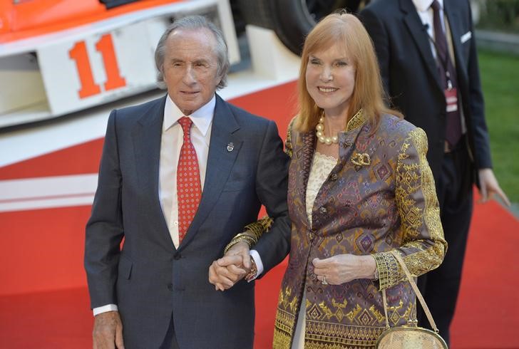 © Reuters. Former Formula One driver Jackie Stewart and his wife Helen arrive at the world premiere of Rush at a cinema in Leicester Square, central London