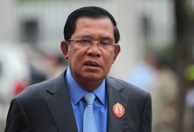 © Reuters. President of the ruling Cambodian People's Party (CPP) and Prime Minister Hun Sen attends a ceremony at the party headquarters to mark the 65th anniversary of the establishment of the party in Phnom Penh