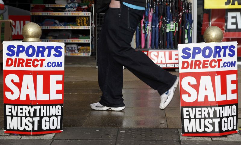 © Reuters. File photo of a pedestrian walking past a branch of Sports Direct in Liverpool