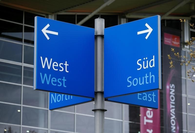 © Reuters. A sign shows the cardinal directions East, South, West and North at the Hannover Fair grounds in Hanover