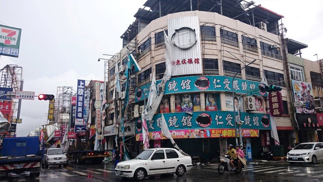 © Reuters. Damaged advertisement banners are seen after strong winds and rain from Typhoon Nepartak hit Taitung