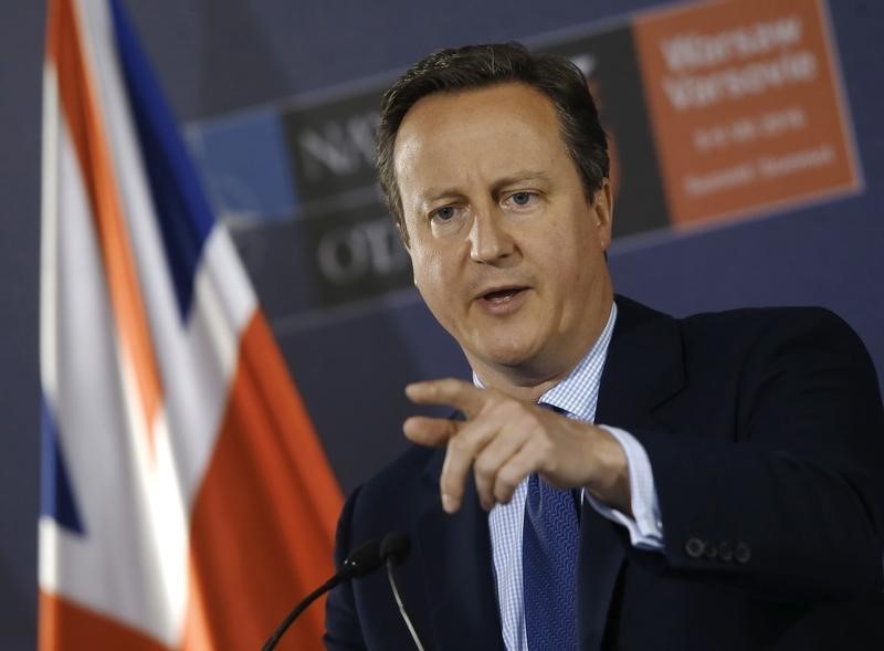 © Reuters. British PM Cameron speaks during a news conference at the PGE National Stadium, the venue of NATO summit, in Warsaw