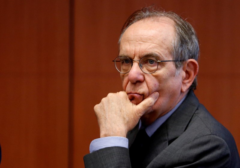 © Reuters. Italy's Finance Minister Padoan waits for the start of an euro zone finance ministers meeting in Brussels