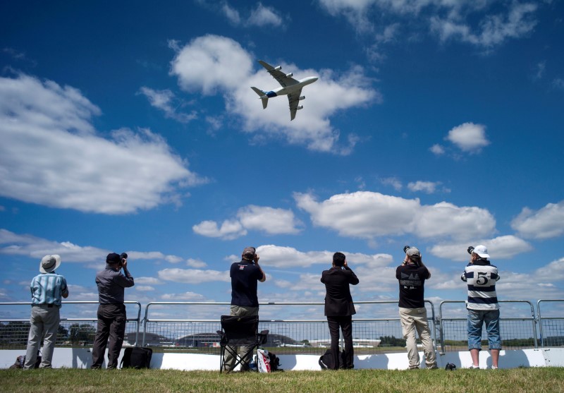 © Reuters. The Airbus Industrie A380 aircraft performs a manoeuvre during its display at the 2014 Farnborough International Airshow in Farnborough