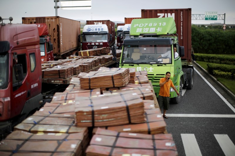 © Reuters. File photo of trucks carrying copper and other goods in Shanghai