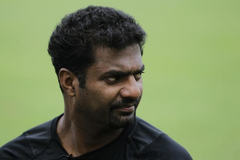 © Reuters. Sri Lankan cricketer Muttiah Muralitharan looks on during an interview with media at Singapore Cricket Club