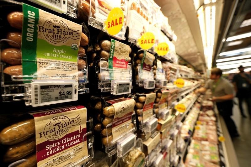 © Reuters. Prices of packaged sausages are displayed on digital price tags at a 365 by Whole Foods Market grocery store ahead of its opening day in Los Angeles