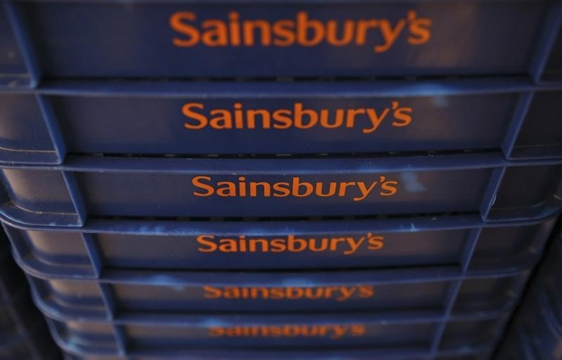 © Reuters. Shopping baskets are displayed at a Sainsbury's store in London