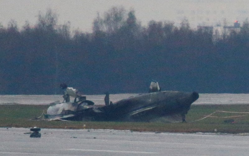 © Reuters. The wreckage of what is believed to be Christophe de Margerie's Dassault Falcon jet is seen at Moscow's Vnukovo airport