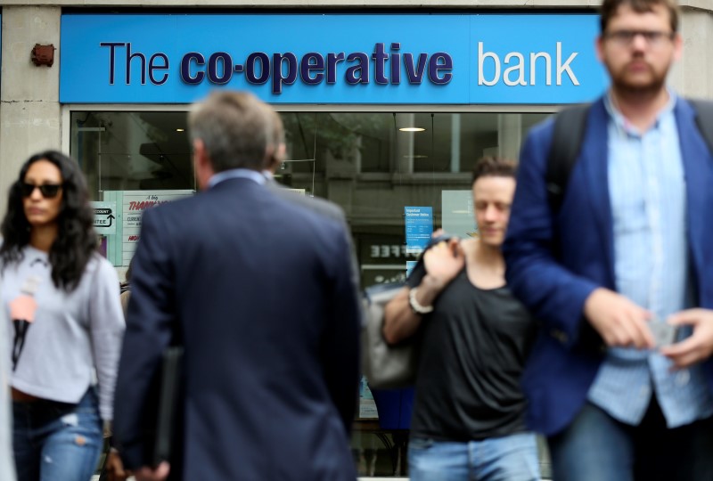 © Reuters. People walk past a branch of the Co-Operative Bank in central London