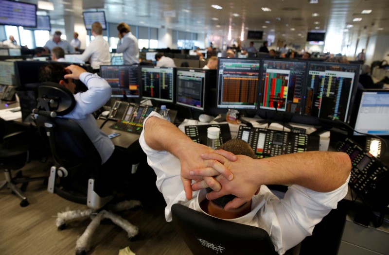 © Reuters. A trader from BGC, a global brokerage company in London's Canary Wharf financial centre reacts during trading