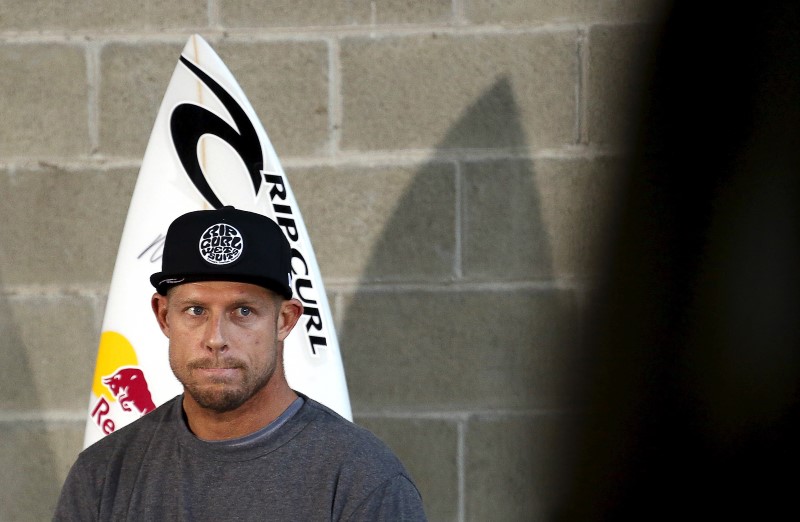 © Reuters. Fanning of Australia, who survived a shark attack, reacts during a media conference in Sydney