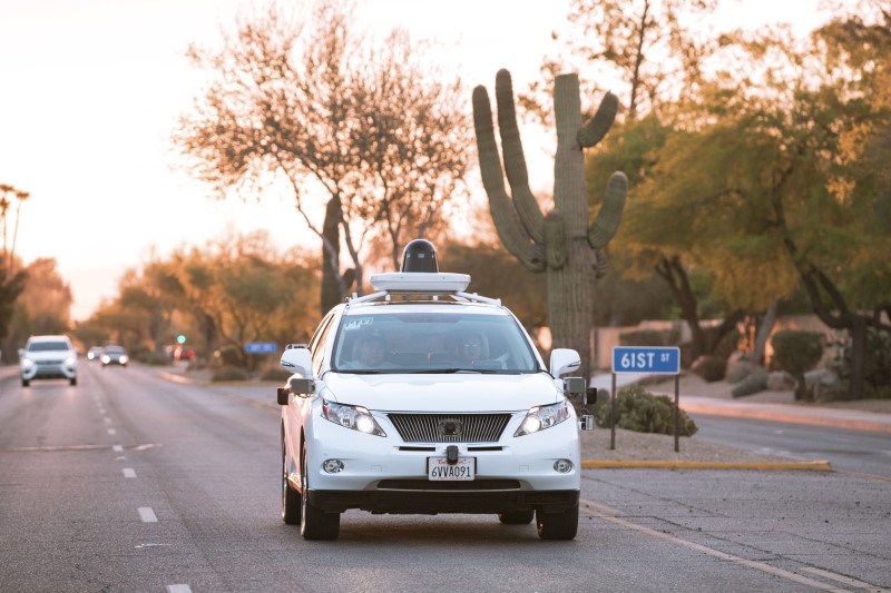 © Reuters. Test drivers use a Lexus SUV, built as a self-driving car, to map the area prior to a journey without a driver in control, in Phoenix