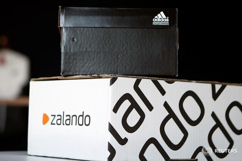 © Reuters. A Adidas shoebox stands above a Zalando cardboard box on a staged scene in Berlin