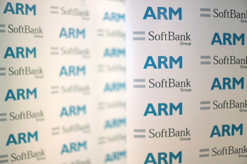 © Reuters. An ARM and SoftBank Group branded board is displayed at a news conference in London