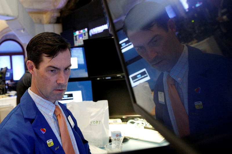 © Reuters. A specialist trader works at his post on the floor of the NYSE