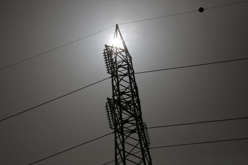 © Reuters. Electricity mast is seen in Rome