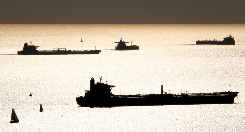 © Reuters. Oil and gas tankers are anchored off the Marseille harbour