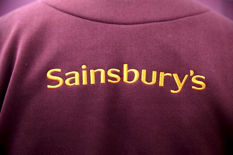 © Reuters. The Sainsbury's Logo is displayed on an employee uniform in a store in London, Britain