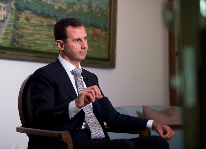 © Reuters. Syria's President Bashar al-Assad speaks during an interview with a Cuban news agency