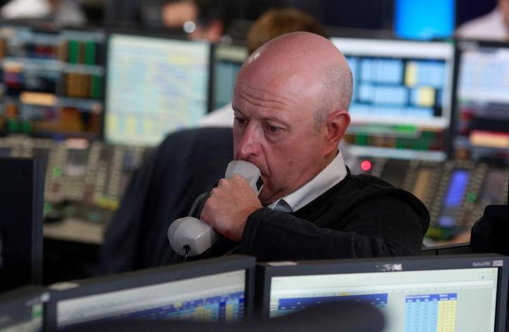 © Reuters. A trader from BGC Partners, a global brokerage company in London's Canary Wharf financial centre waits for European stock markets to open