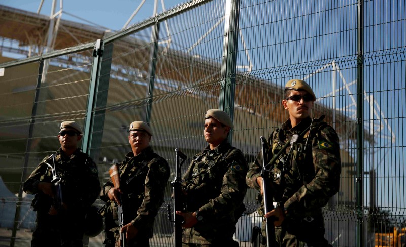 © Reuters. Special police forces stand guard outside the Olympic Park in Rio de Janeiro