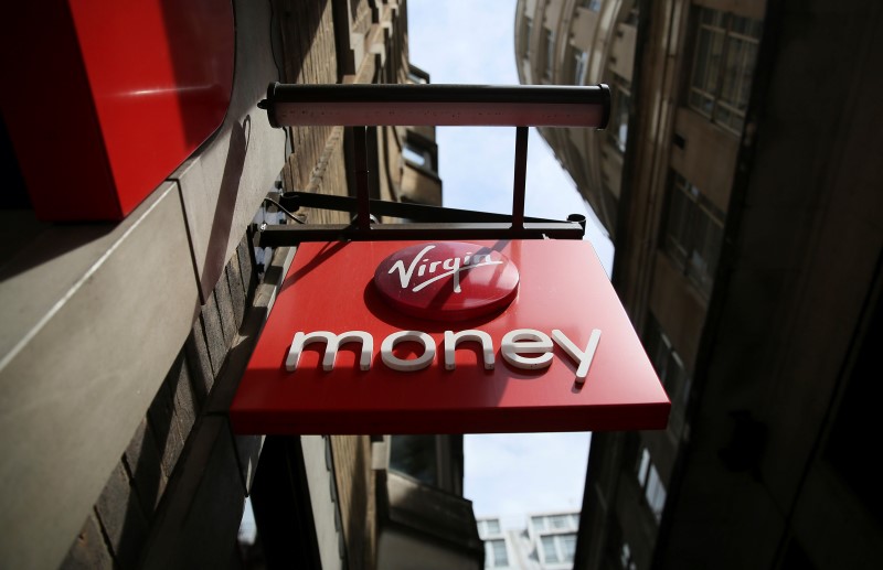 © Reuters. A sign is displayed on a Virgin Money store in London