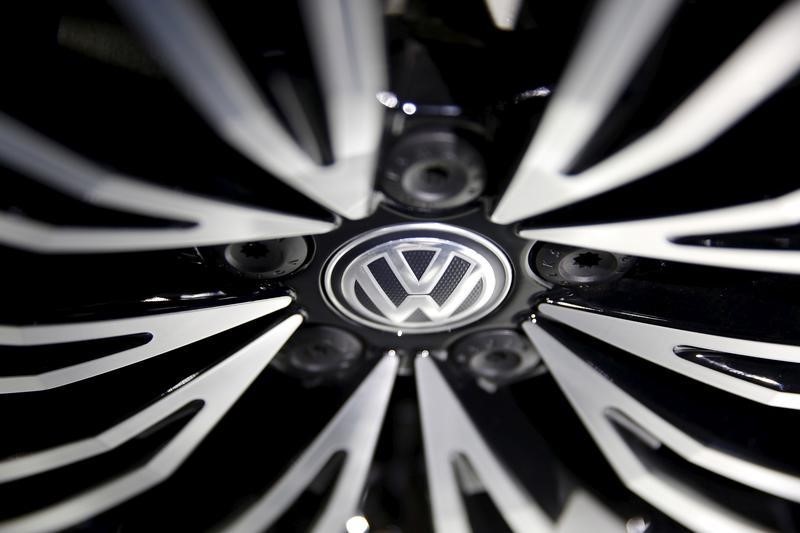 © Reuters. A Volkswagen sign is seen on a wheel of a car presented during an auto show in Beijing