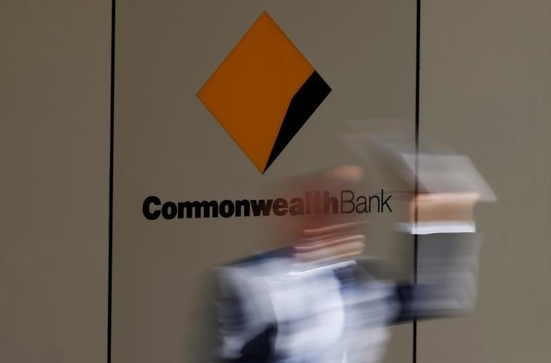 © Reuters. A man leaves the Commonwealth Bank of Australia building in central Sydney