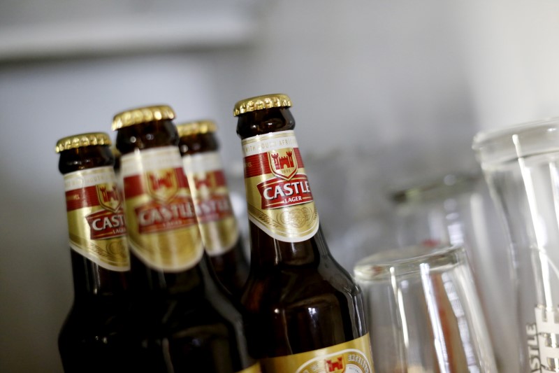 © Reuters. Bottles of SABMiller's flagship brew, Castle Lager are seen at a bar in Cape Town
