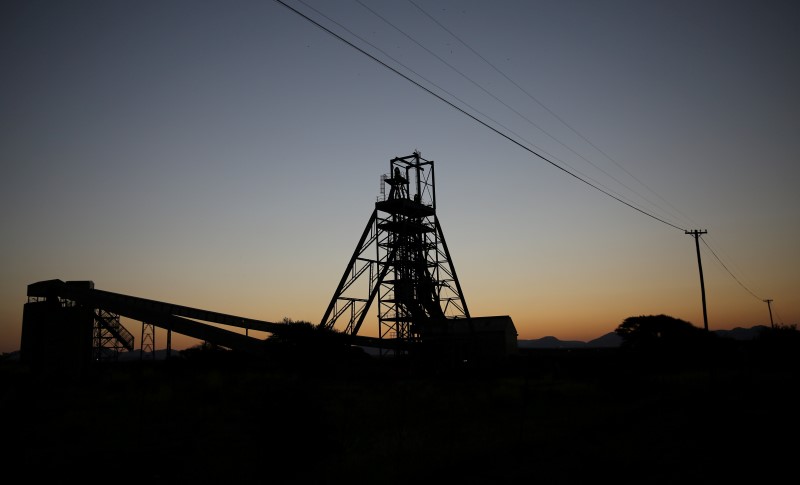 © Reuters. A mine shaft is seen at the Tumela Mine , an Anglo American  open pit mine Australia's Bheki Msobo (L) plays a shot during the second T20 International  match against South Africa at the  Wanderers Stadium, Johannesburg