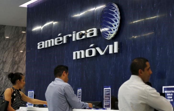 © Reuters. The America Movil logo is seen at the reception area in the company's offices in Mexico City