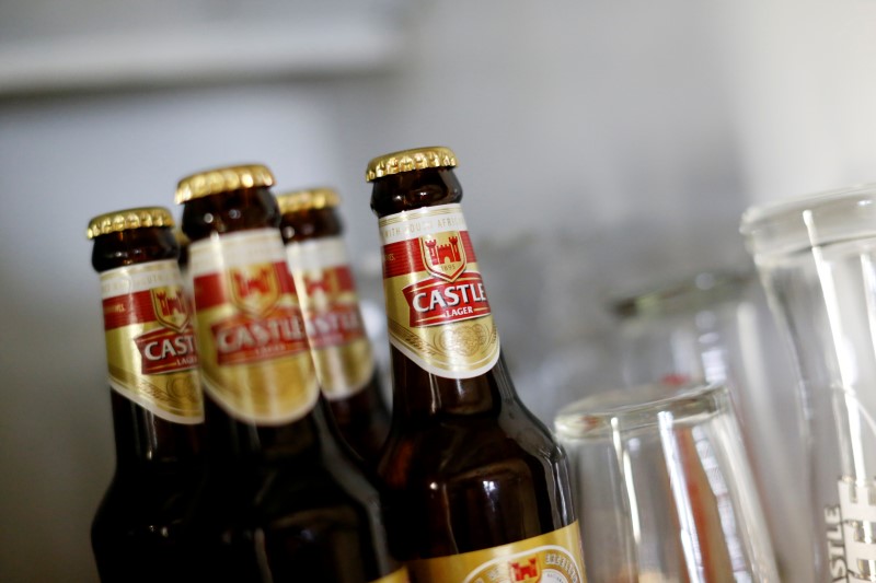© Reuters. Bottles of SABMiller's flagship brew, Castle Lager are seen at a bar in Cape Town