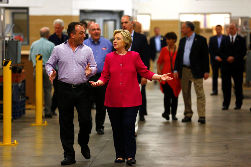 © Reuters. Democratic presidential candidate Hillary Clinton is given a tour by K'NEX CEO Michael Araten in Hatfield, Pennsylvania