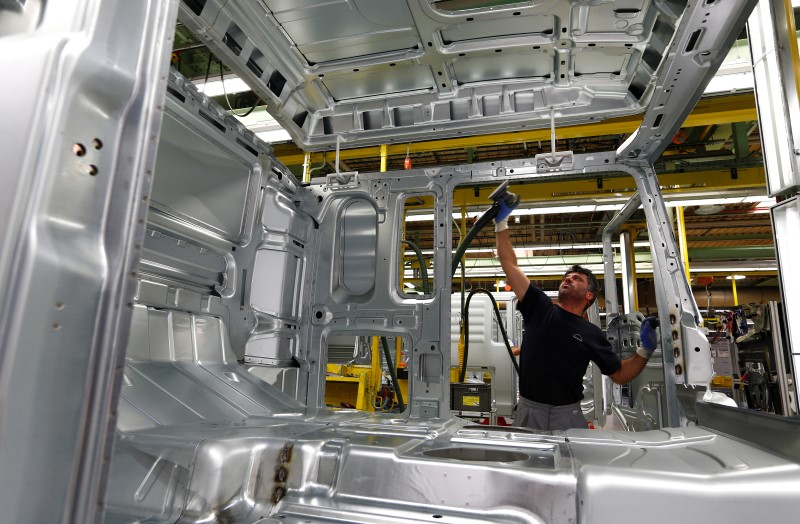 © Reuters. A man works at the assembly line in the truck production plant of truck and bus-maker MAN AG in Munich