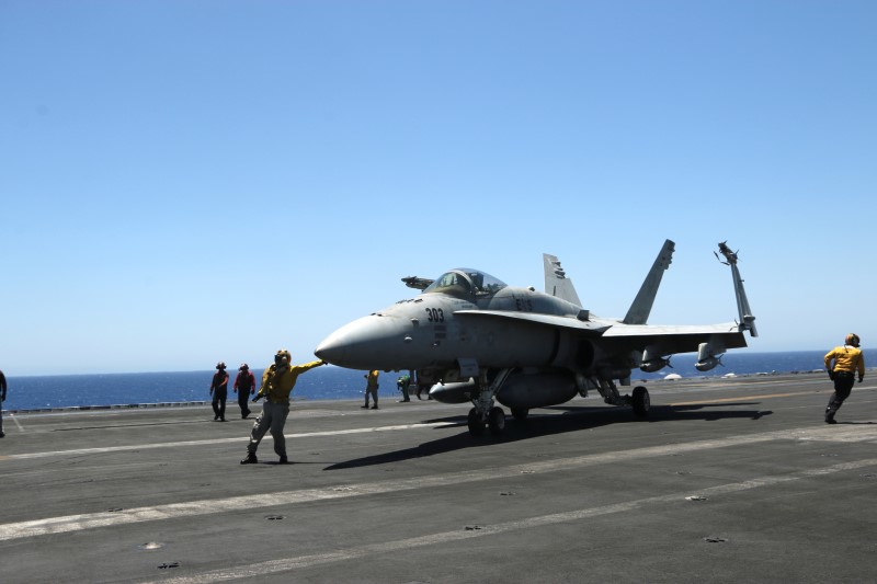 © Reuters. F/A-18 fighter jet takes off at the USS Harry S. Truman aircraft carrier in the eastern Mediterranean Sea