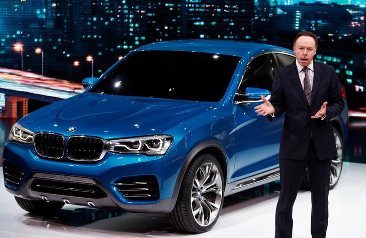 © Reuters. BMW sales chief Robertson speaks next to a BMW Concept X4 vehicle during the opening day of the 15th Shanghai International Automobile Industry Exhibition in Shanghai