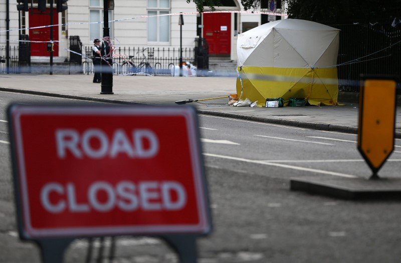 © Reuters. A forensics tent stands behind police tape after a knife attack in Russell Square in London