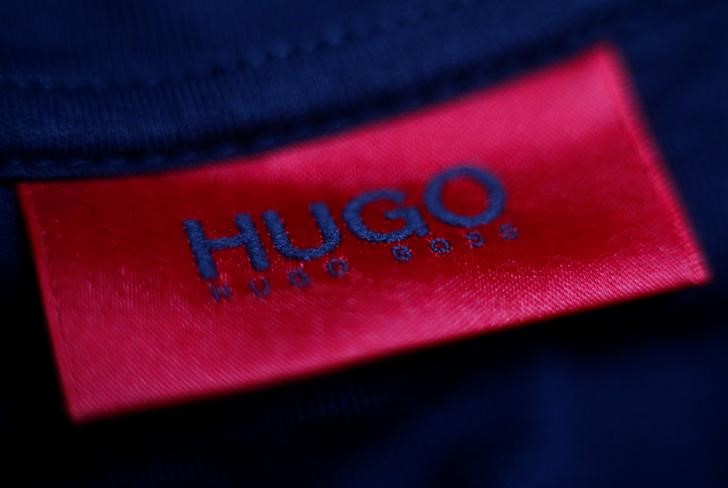 © Reuters. The logo of German fashion house Hugo Boss is seen on a clothing label at their outlet store in Mezingen near Stuttgart