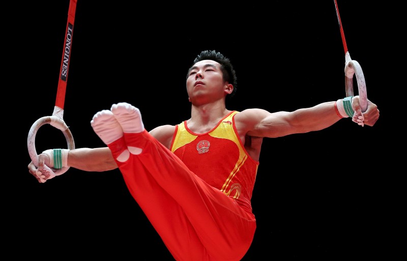 © Reuters. China's Liu Yang performs during his rings exercise in the men's apparatus final at the World Gymnastics Championships at the Hydro arena in Glasgow