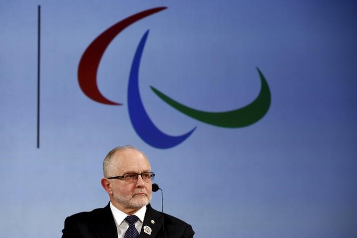 © Reuters. President of the International Paralympic Committee Philip Craven attends a news conference after signing a partnership deal with the Toyota Motor Corporation in Tokyo