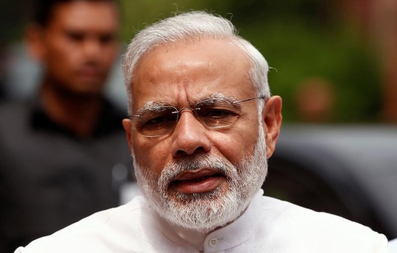 © Reuters. India's PM Modi speaks to the media inside the parliament premises on the first day of the monsoon session in New Delhi