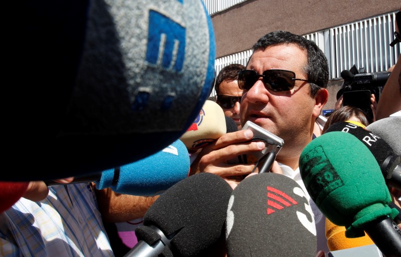 © Reuters. Raiola, agent of Barcelona's player Ibrahimovic, speaks to the media as he arrives at FC Barcelona's office in Barcelona