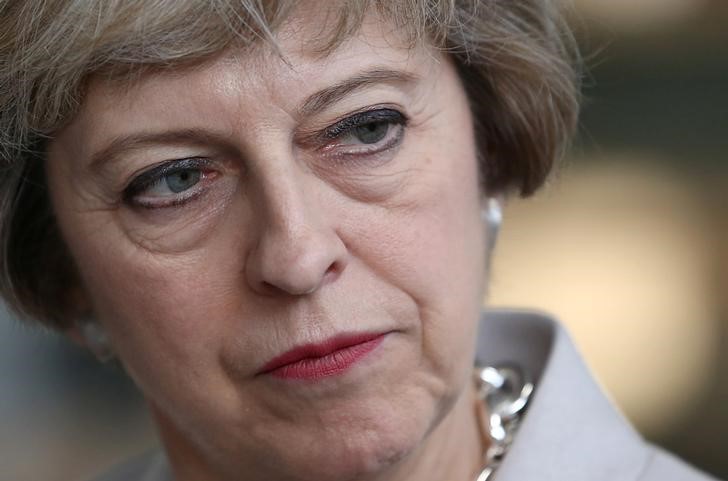 © Reuters. Britain's Prime Minister Theresa May visits a joinery factory in London