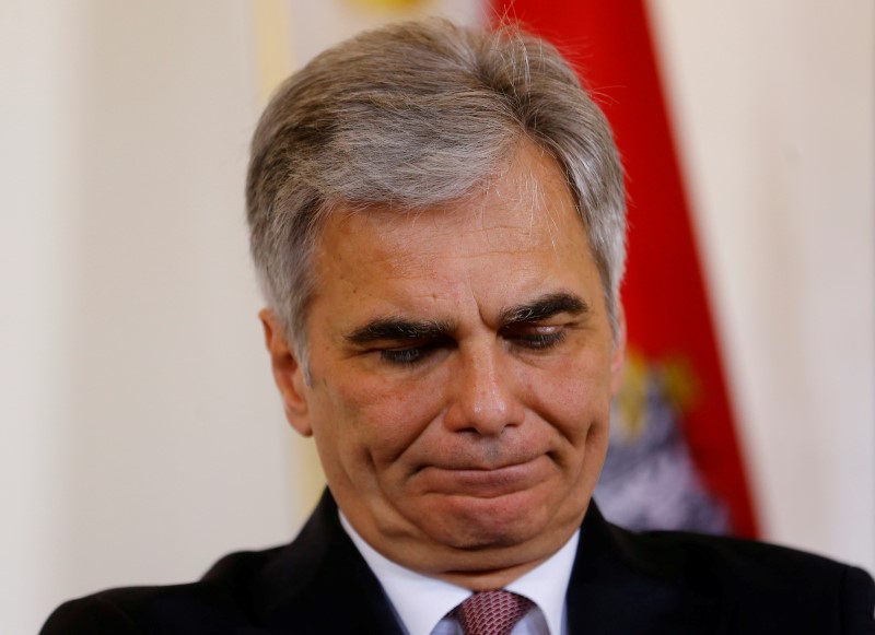 © Reuters. Austria's Chancellor Faymann listens during a news conference in Vienna