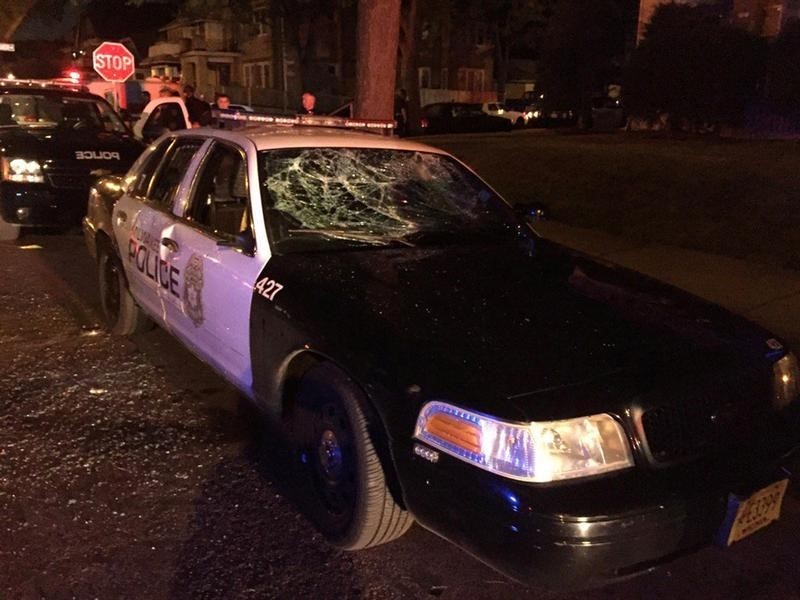 © Reuters. A police car with broken windows is seen in a photograph released by the Milwaukee Police Department after disturbances following the police shooting of a man in Milwaukee