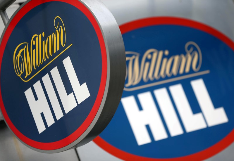© Reuters. A branded sign is displayed outside a William Hill betting shop in London